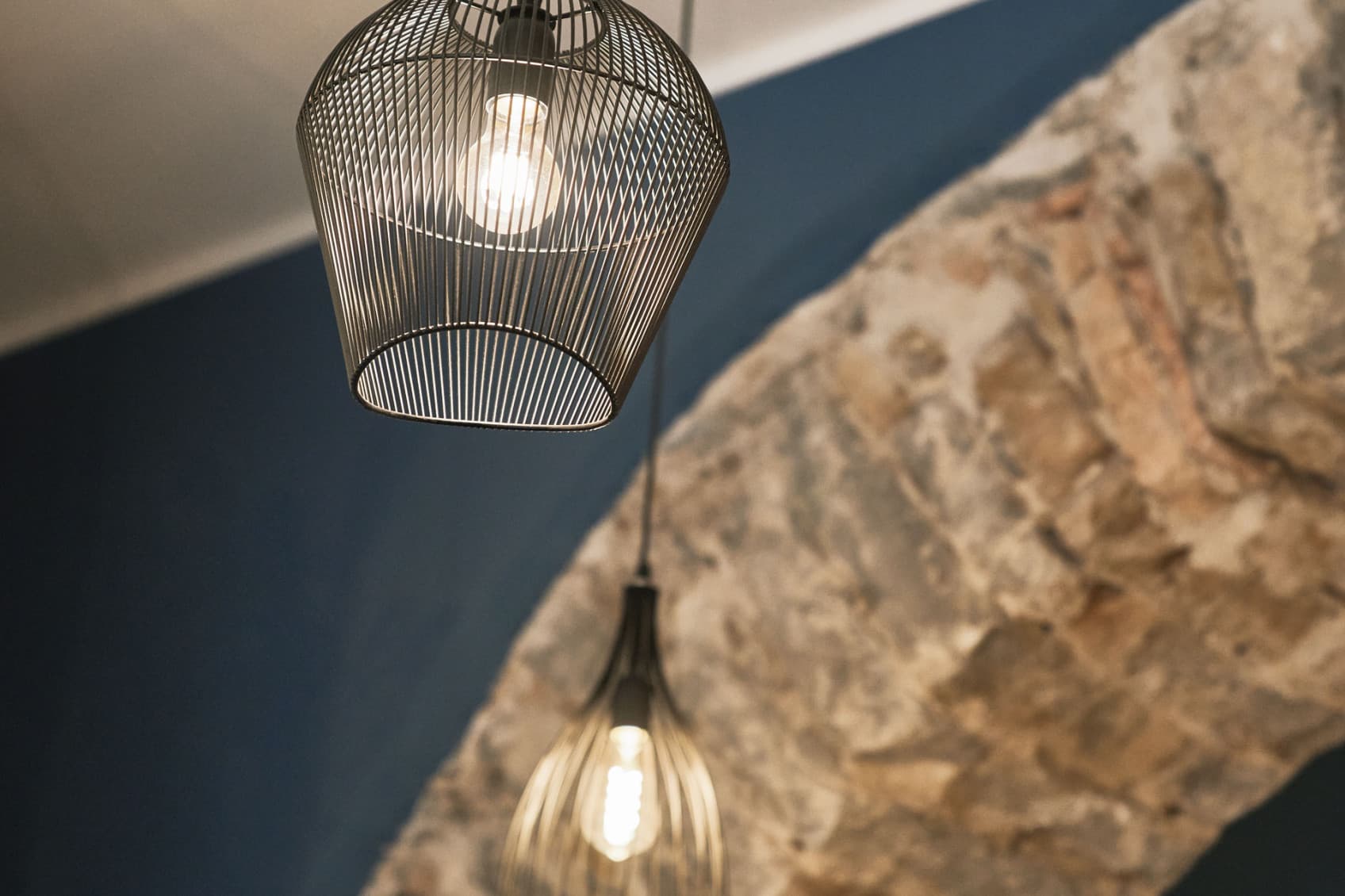 Seen is a details picture of the beautifully rennovated stores. The stone archway is complimented by a modern and urban lamp, that highlights the URBANAUTS concept of combining new with old.